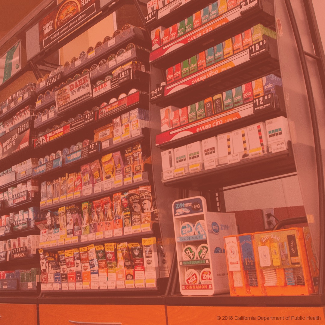 Convenience store shelves stocked with cigarettes. Copyright 2018 California Department of Public Health
